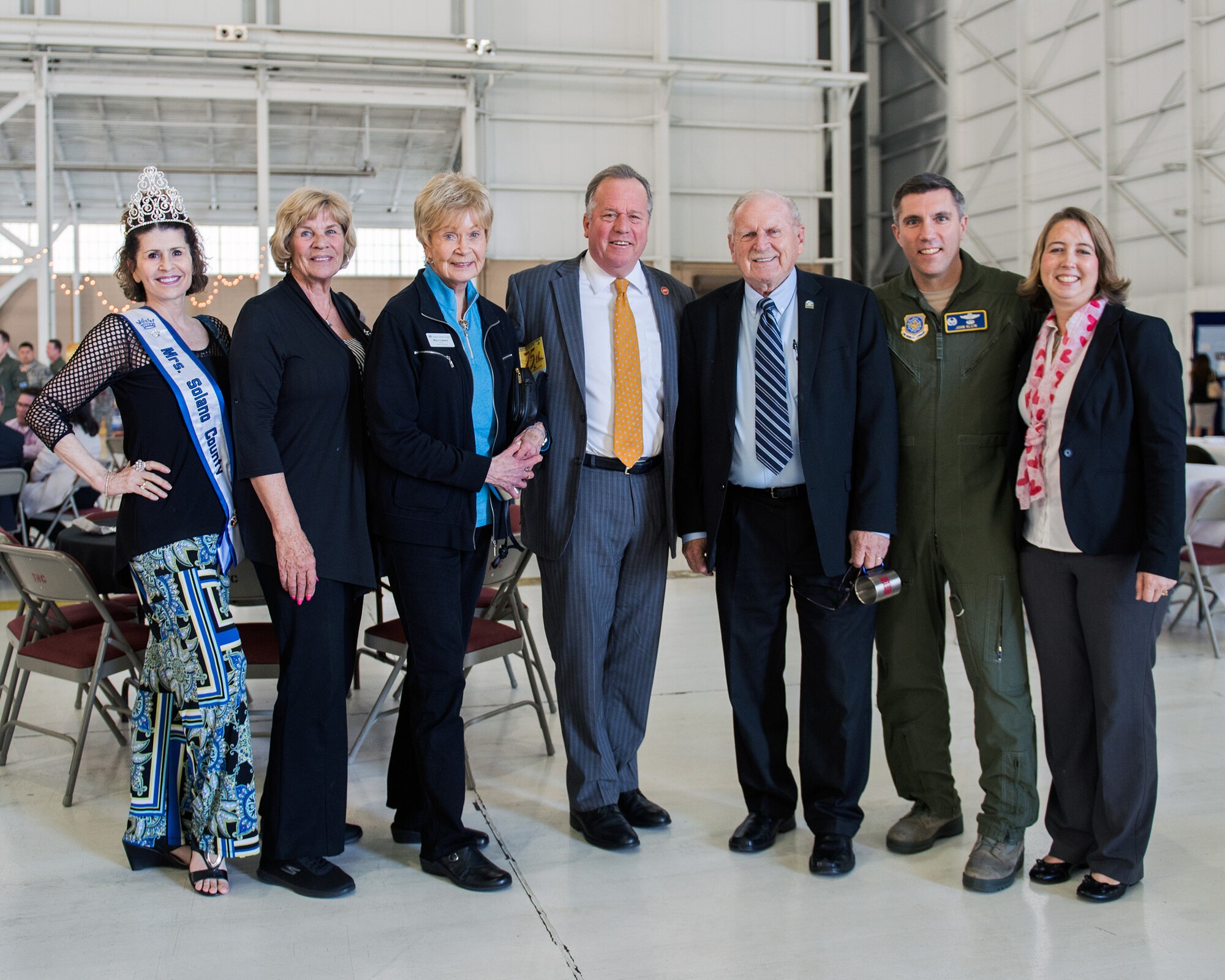 State Senator Bill Dodd (D-Napa), 3rd Senate District, center, poses for a photo with U.S. Air Force Col. John Klein, 60th Air Mobility Wing commander, second from the right, and others during the 75th Anniversary kickoff celebration at Travis Air Force Base, Calif., Feb. 8, 2018. The celebration featured the inaugural unveiling of the 75th Anniversary logo on a C-17 Globemaster III. Travis is celebrating 75 years as a major strategic logistics hub for the Pacific and integral part of global power projection for the total force. (U.S. Air Force photo by Louis Briscese)