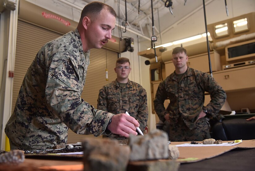U.S. Marine Corps Staff Sgt. Justin Golden, Detachment 3 Supply Company, Combat Logistics Battalion 451, explains tactical convoy operation briefing procedures as part of a three day training event at Joint Base Charleston’s Weapons Station Feb. 11, in South Carolina.