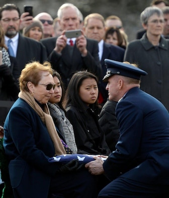 Air Force Vice Chief of Staff Gen. Stephen Wilson presents the American flag to the next of kin during the full honors funeral ceremony for retired Col. Leo Thorsness at Arlington National Cemetery, Arlington, Va., Feb. 14, 2018. Thorsness received the Medal of Honor for his heroic actions during the Vietnam War. (U.S. Air Force photo by Staff Sgt. Rusty Frank)