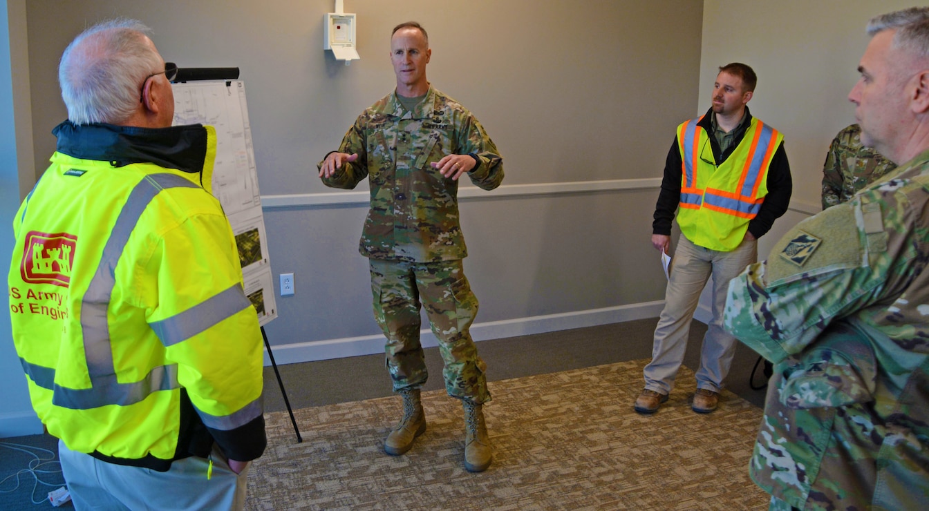 USACE Deputy Commanding General Maj. Gen. Michael Wehr, center, discusses the newly-completed U.S. Army Special Operations Command (USASOC) Language and Culture Center at Fort Bragg with Resident Engineer Doug Wood, left, of the USASOC Resident Engineer Office at Fort Bragg. At right is Wilmington District Commander Col. Rob Clark who hosted the tour, along with project manager Brian Whitley. (USACE photo by Hank Heusinkveld)