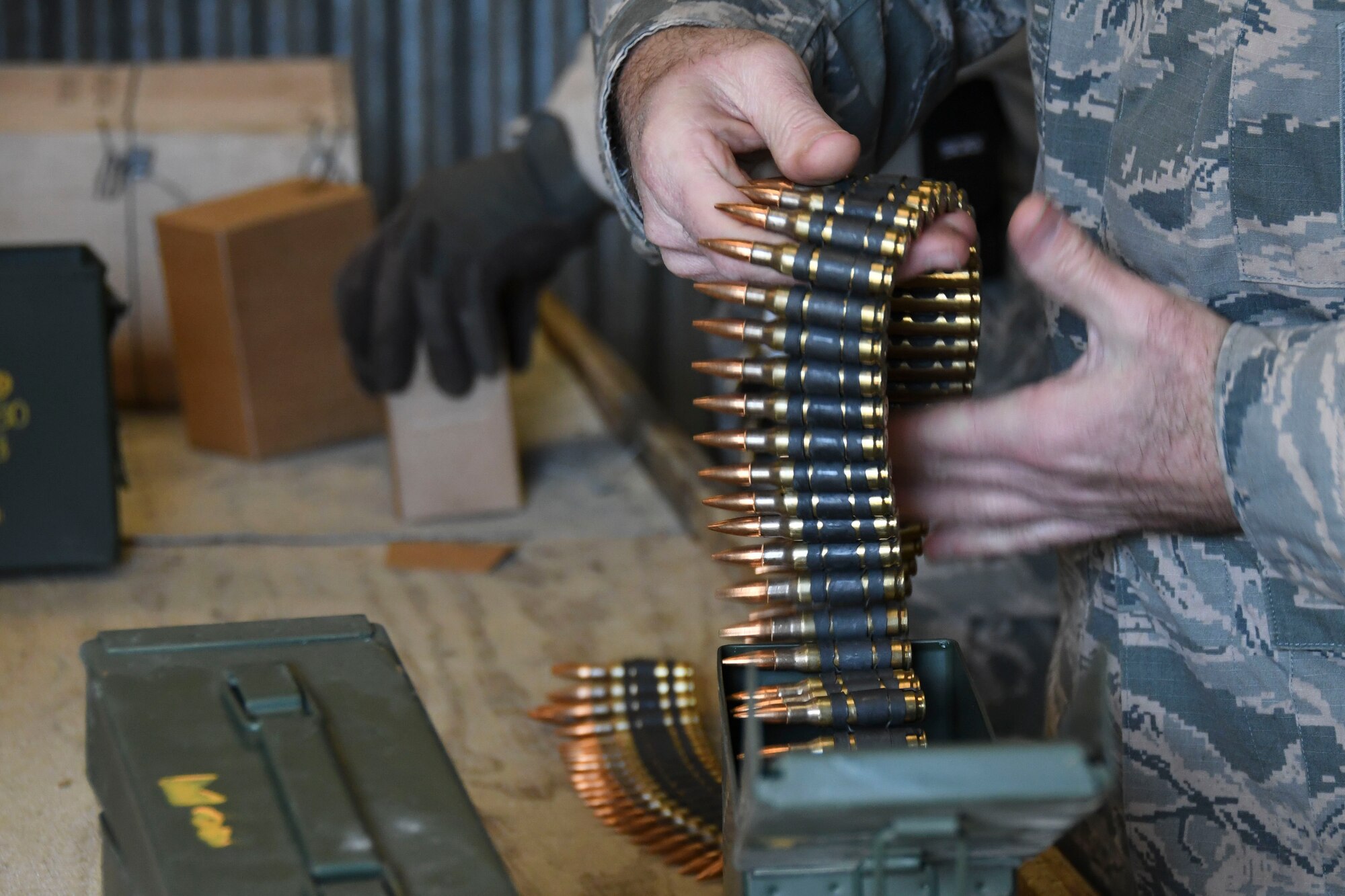 U.S. Air Force Combat Arms Instructor assigned to the 307th Security Forces Squadron demonstrates how to load 7.62 mm rounds during annual weapons training Feb. 9, 2018 at Fort Polk, Louisiana.