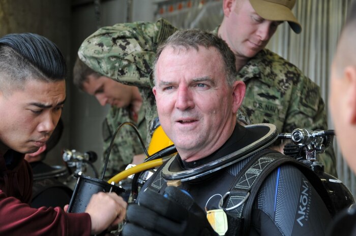 PANAMA CITY, Florida - Commander, Navy Expeditionary Combat Command Rear Adm. Brian Brakke, USN, dives the Diver Augmented Vision Display heads up display system Feb. 1, 2018 at Naval Diving and Salvage Training Center in Panama City, Florida. DAVD is a real time, heads-up display created by Naval Surface Warfare Center Panama City Division project team. (RELEASED). U.S. Navy photo by Jacqui Barker, NSWC PCD.