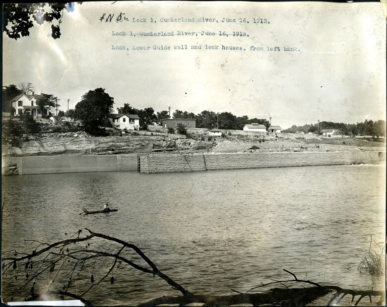 This is the lower guide wall and lock houses from the left bank at Lock 1 on the Cumberland River in Nashville, Tenn., June 16, 1913. The U.S. Army Corps of Engineers Nashville District built Lock and Dam 1 at this location to establish a navigation channel.  The structure was later replaced by today's modern dams. (USACE Photo)