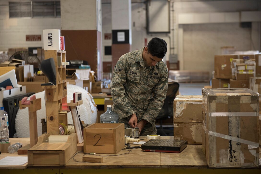 U.S. Air Force Airman 1st Class Casey Nydoske, 18th Logistics Readiness Squadron Traffic Management Office outbound specialist, prepares cargo for shipment, Feb. 14, 2018, at Kadena Air Base, Japan. The majority of items shipped through TMO are for repairs. (U.S. Force photo by Senior Airman Omari Bernard)