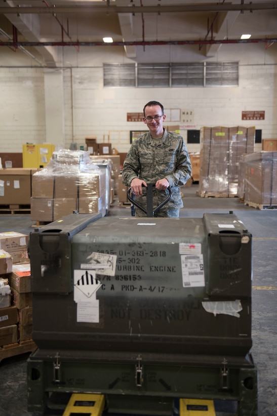 U.S. Air Force Senior Airman Michael Olson, 18th Logistics Readiness Squadron Traffic Management Office outbound specialist, transports cargo to a packing station Feb. 14, 2018, at Kadena Air Base, Japan. Before any cargo is shipped out, Airmen from TMO outbound verify the asset, inspect the item for damage, and then prepare the cargo for the appropriate transportation. (U.S. Air Force photo by Senior Airman Omari Bernard)