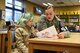 Airman 1st Class Sarah Marcinko, 569th United States Forces Police Squadron security forces personnel, reads with children on Feb. 6, 2018 at Vogelweh Elementary School on Vogelweh Military Complex, Germany. The Read with Me program is designed to provide increased opportunities for students to read aloud.