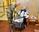 Army Master Sgt. Jose Moraga introduces himself to a patient waiting for care at the Corporal Michael J. Crescenz Veterans Affairs Medical Center, Feb. 12, 2018 in Philadelphia.