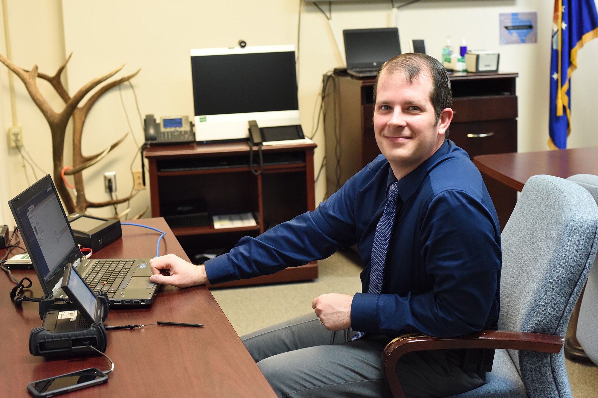 Bryan Wolfe, Air Force Office of Special Investigations special agent and superintendent, assigned to Malmstrom Air Force Base, Mont., demonstrates equipment on Feb. 14, 2018, which special agents use in the field to extract data from mobile devices and to create copies of information from computer hard drives. Often the information is sent to AFOSI subject matter experts who are employed for their science, technology, engineering and math expertise, professional fields that the Air Force and AFOSI actively recruit for. (U.S. Air Force photo by Kiersten McCutchan)