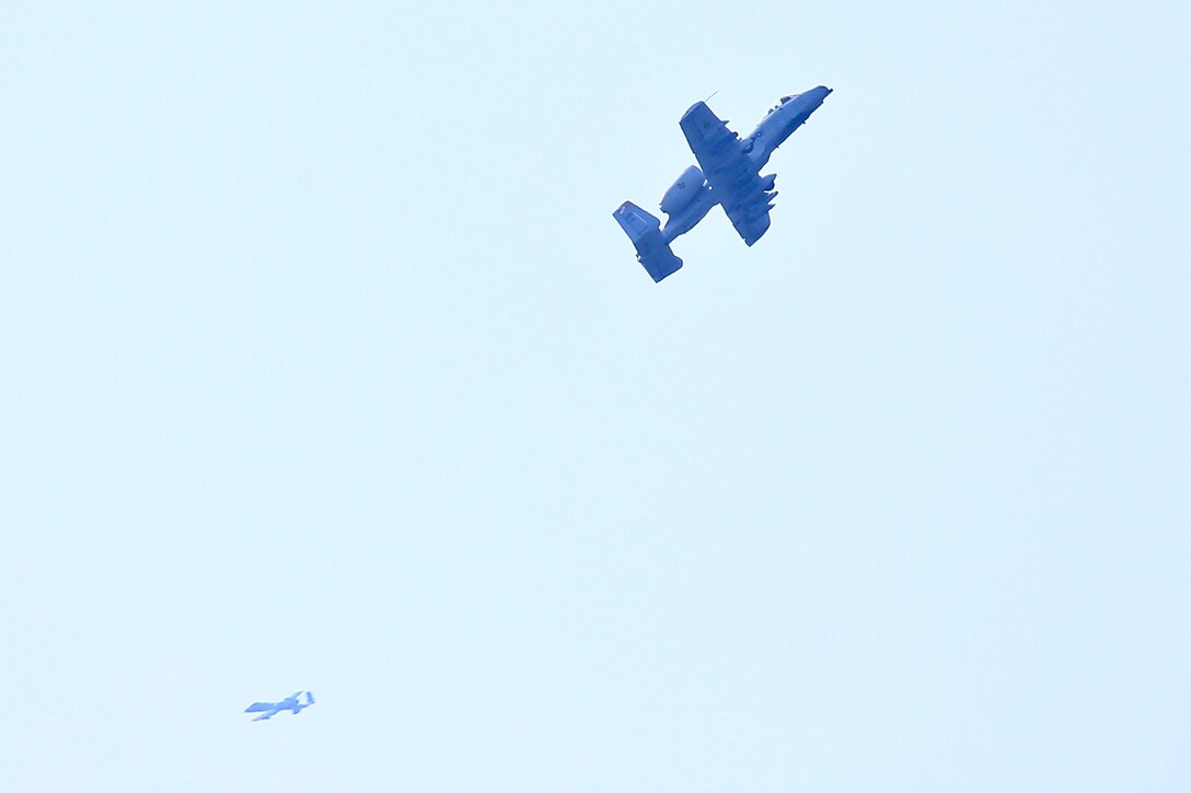 Air Force A-10 aircraft circle overhead during training.