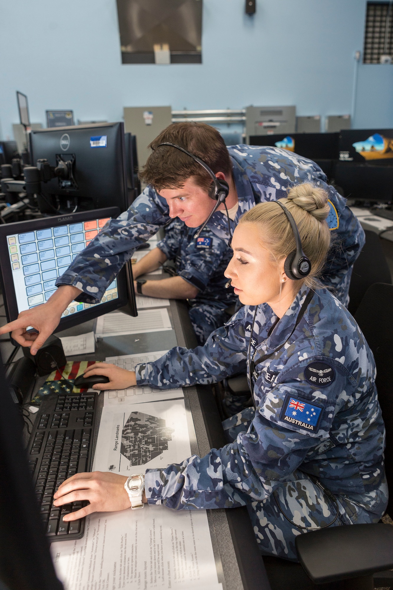 Flight Lieutenat Michael Pickering an Air Warfare Instructor and Flying Officer Stephanie Geaney a Air Battle Manager, monitors the airspace in the Control Reporting Centre at Nellis Air Base, Nevada, During Exercise Red Flag 18-1. (Courtesy Photo)