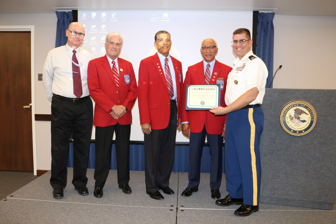 Wade McVey, Defense Contract Management Agency Phoenix deputy commander (left) and Army Col. Robert Miceli, commander (right), present a certificate of appreciation to three Tuskegee Airmen, David Toliver Sr., James Katra and Ted Vactor, at a Feb. 7 National African American History Month event at the agency’s Phoenix office. The Tuskegee Airmen spoke about the history of black military pilots and ground crewmembers who served during World War II. (DCMA photo by Marissa Krings)