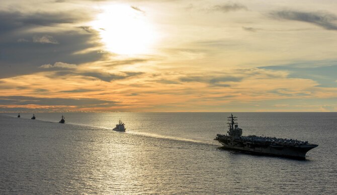 Ships sail in formation in the Persian Gulf.