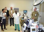 Army Col. Booker King explains the life-saving advances provided by the adult extracorporeal membrane oxygenation, or ECMO, program to federal participants in the Leadership Federal Executive Board during a tour of the San Antonio Military Medical Center Feb. 14 in San Antonio. The tour was part of a health care services day organized by the LFEB that included additional medical facilities to develop a better understanding of federal community. The LFEB is made up of 45 class members from various federal agencies across San Antonio who meet monthly to learn from key decision-makers in both the public and private sectors. SAMMC received national recognition in 2017 for its ECMO program, which is a heart-lung bypass system used in the treatment of affected organs. King is a surgeon assigned to SAMMC.