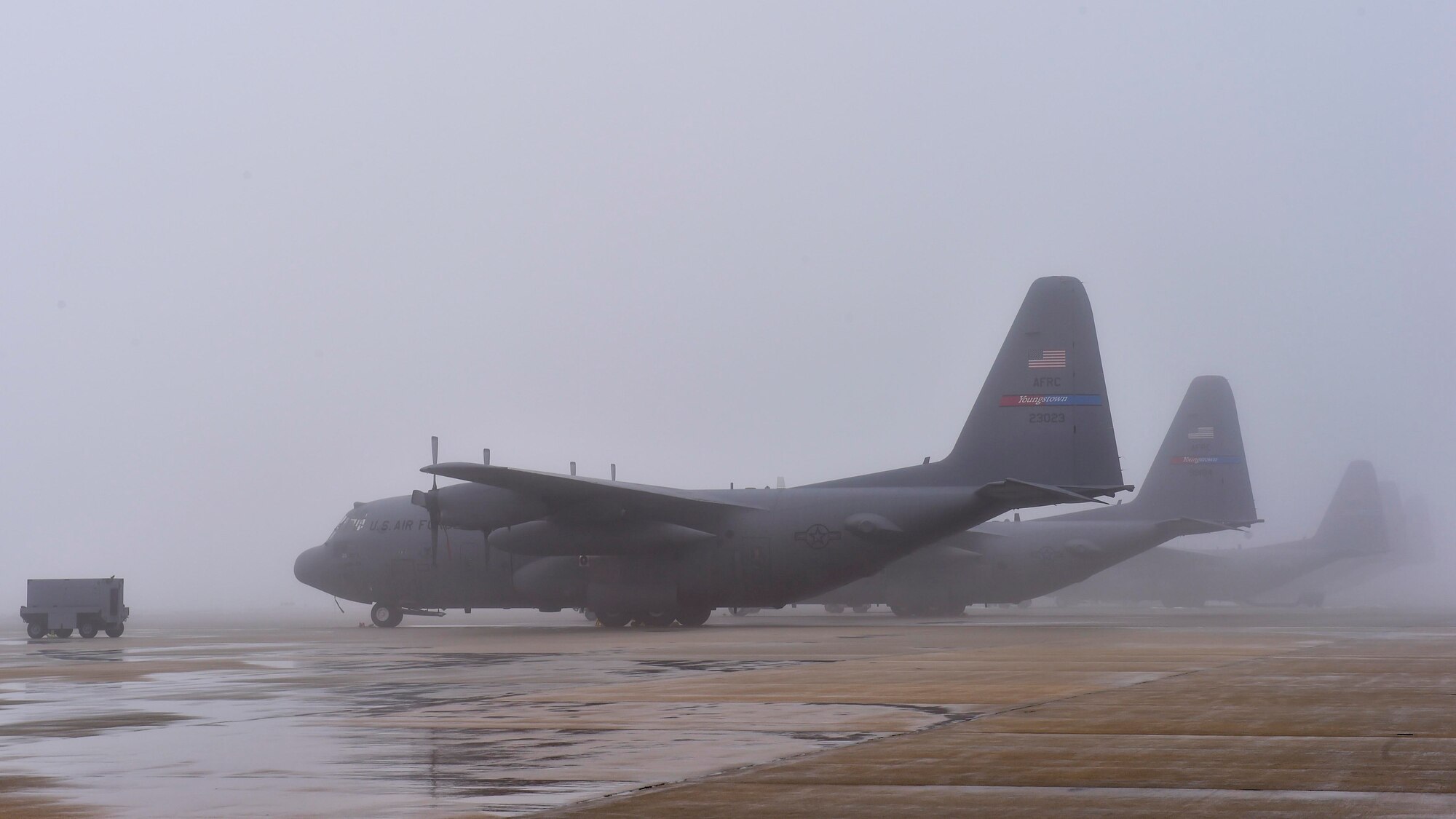 10th Aircraft Maintenance Squadron maintainers marshall a C-130H Hercules aircraft while it's being towed into a hangar here, Feb. 11, 2018.