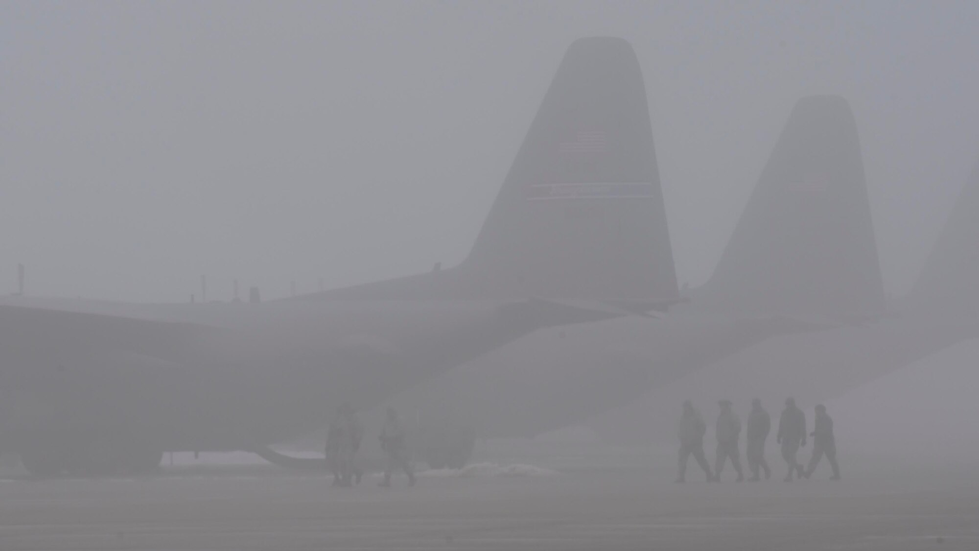 10th Aircraft Maintenance Squadron maintainers marshall a C-130H Hercules aircraft while it's being towed into a hangar here, Feb. 11, 2018.