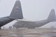 10th Aircraft Maintenance Squadron maintainers marshall a C-130H Hercules aircraft while it's being towed into a hangar here, Feb. 11, 2018.