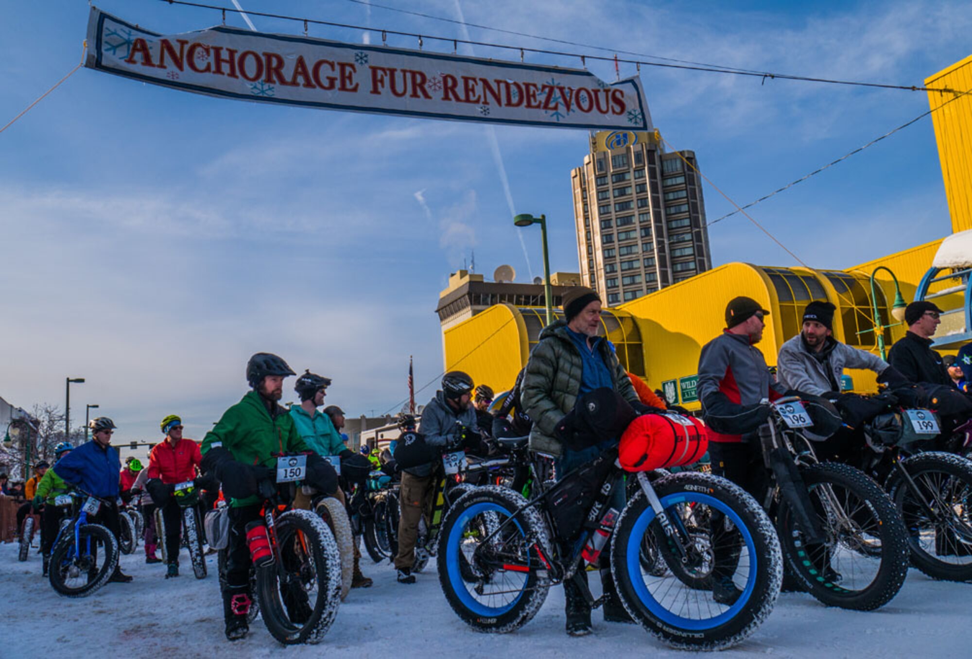 Participants take part in the Big Fat Ride featured as one of the Fur Rendezvous events scheduled during the 12-day festival, held each February in Anchorage, Alaska. The festival was started as a three-day event arranged to coincide with the return of miners and trappers loaded down with the profits of a winter’s worth of work.