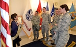 Hue Nguyen, left, DLA Troop Support flag room supervisor, explains the presidential flag manufacturing process to pharmacists of the Air Force Pharmacy Residency Program at DLA Troop Support, Feb. 7, 2018 in Philadelphia.