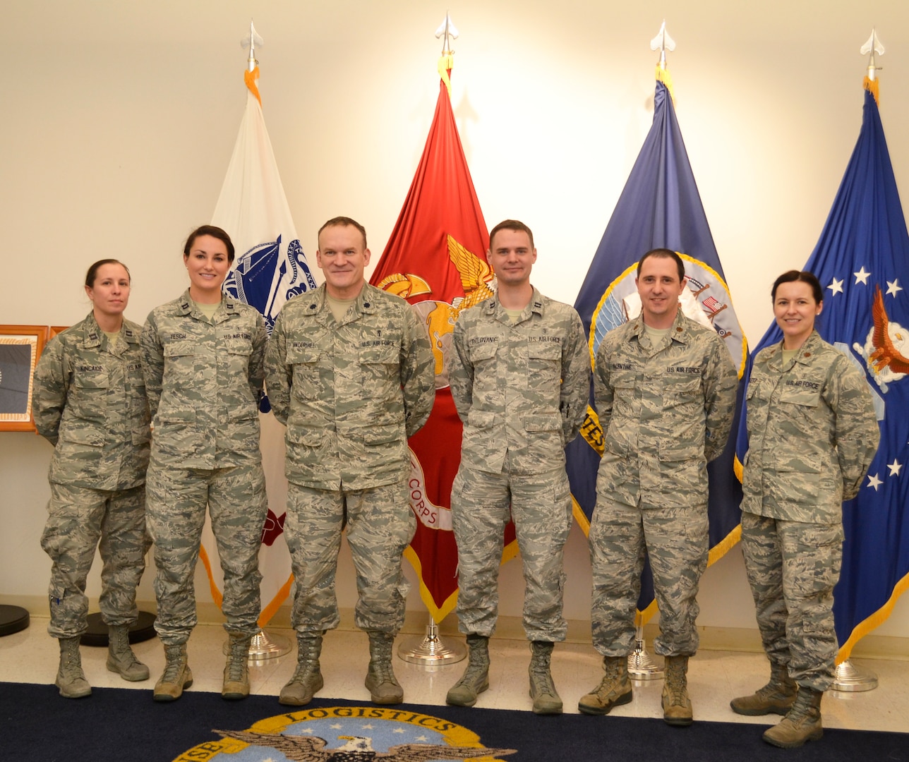 The Air Force Pharmacy Residency Program pharmacists pose with Lt. Col. Derek Underhill, left center, Customer Pharmacy Operations Center branch chief, for a group photo at DLA Troop Support, Feb. 7, 2018 in Philadelphia.