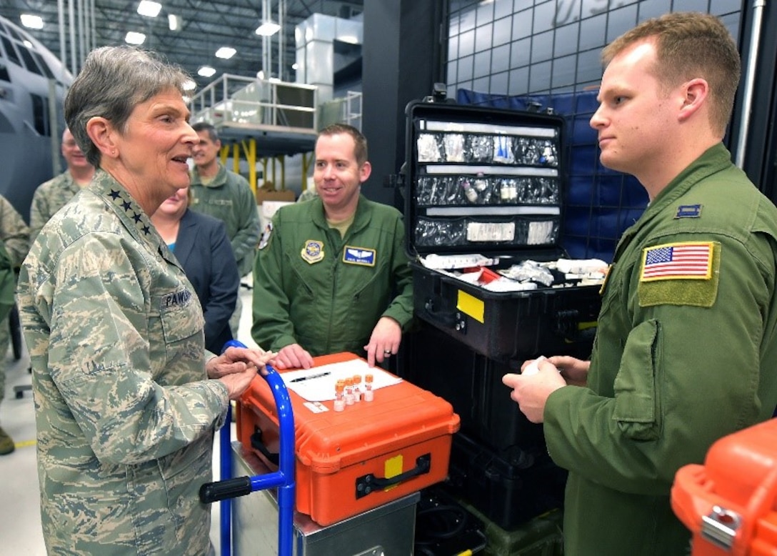 Gen. Ellen Pawlikowski, Air Force Materiel Command commander, discuss job responsibilities with Captains Paul Merrill and Matthew Decker, 375th Operations Group instructors and examiners, during her tour of the U.S. Air Force School of Aerospace Medicine at Wright-Patterson Air Force Base, Ohio, Jan. 30, 2018.