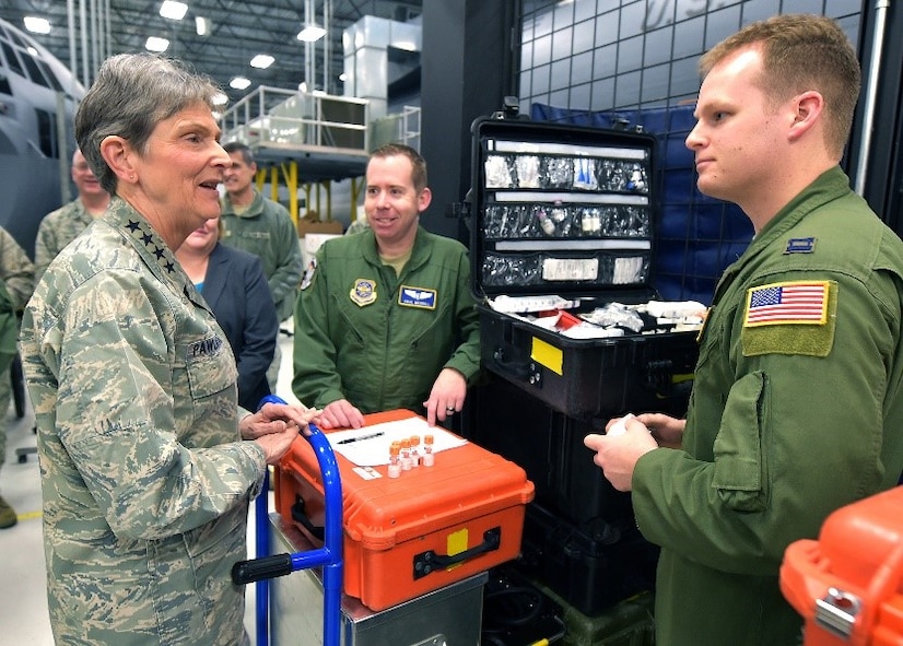 Gen. Ellen Pawlikowski, Air Force Materiel Command commander, discuss job responsibilities with Captains Paul Merrill and Matthew Decker, 375th Operations Group instructors and examiners, during her tour of the U.S. Air Force School of Aerospace Medicine at Wright-Patterson Air Force Base, Ohio, Jan. 30, 2018.
