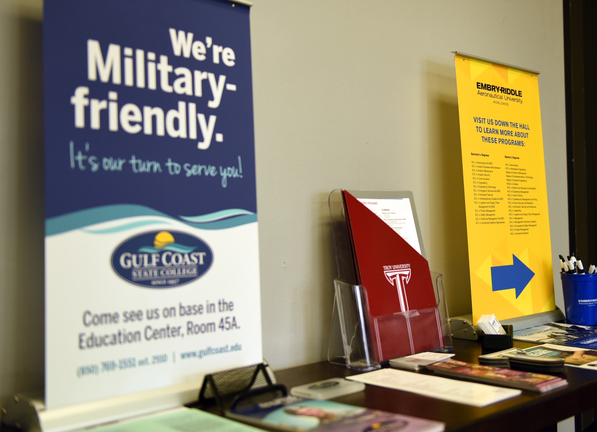 Informational brochures from three schools line a table in the education office at Tyndall Air Force Base, Fla., Feb. 14, 2018. The Tyndall Education Office is partnered with Gulf Coast State College, Troy University and Embry-Riddle Aeronautical University by offering on-base programs to better aid Airmen in pursuing their education desires. (U.S. Air Force photo by Airman 1st Class Isaiah J. Soliz/Released)