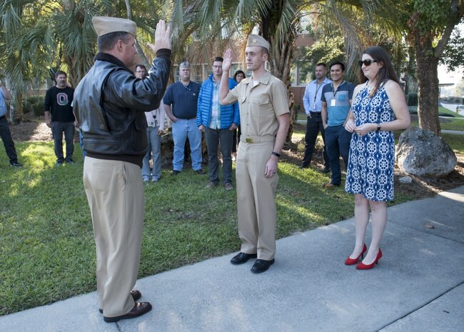 PANAMA CITY, Florida - Naval Surface Warfare Center Panama City Division (NSWC PCD) Scientist and U.S. Navy Ens. Denton Woods is swore into the U.S. Naval Reserves by NSWC PCD Executive Officer Capt. David Stallworth, USN during a commissioning ceremony held Nov. 15, 2017. U.S. Navy photo by Eddie Green.