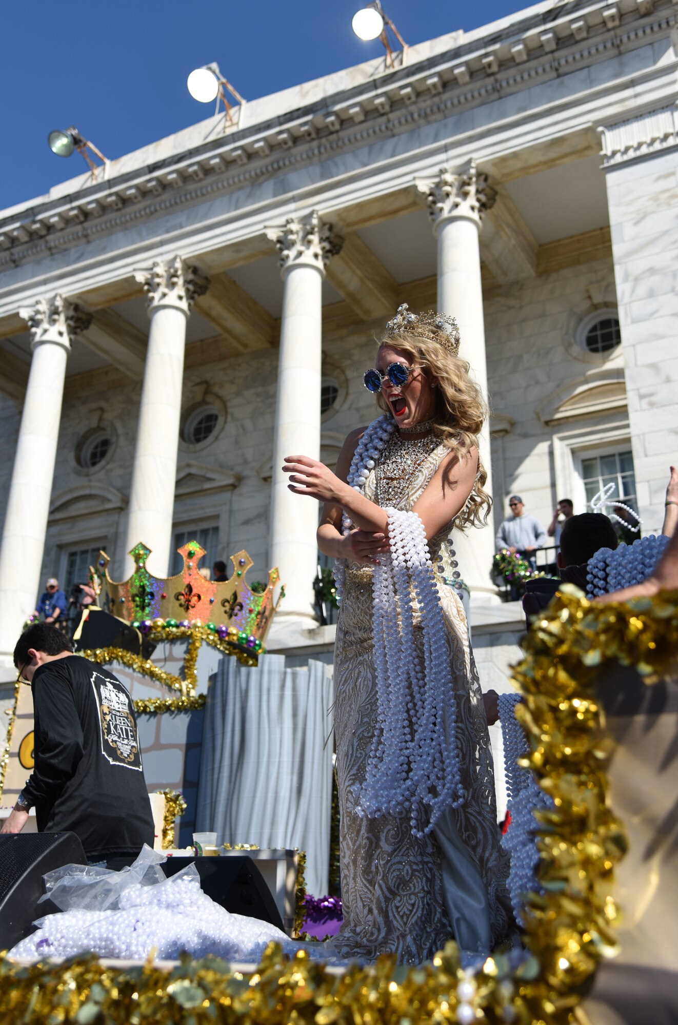 Katherine Rushton, 2018 Queen Ixolib, rides on a parade float during the Gulf Coast Carnival Association Mardi Gras parade Feb. 13, 2018, in Biloxi, Mississippi. Keesler personnel participate in local parades every Mardi Gras season to show their support of the communities surrounding the installation. (U.S. Air Force photo by Kemberly Groue)