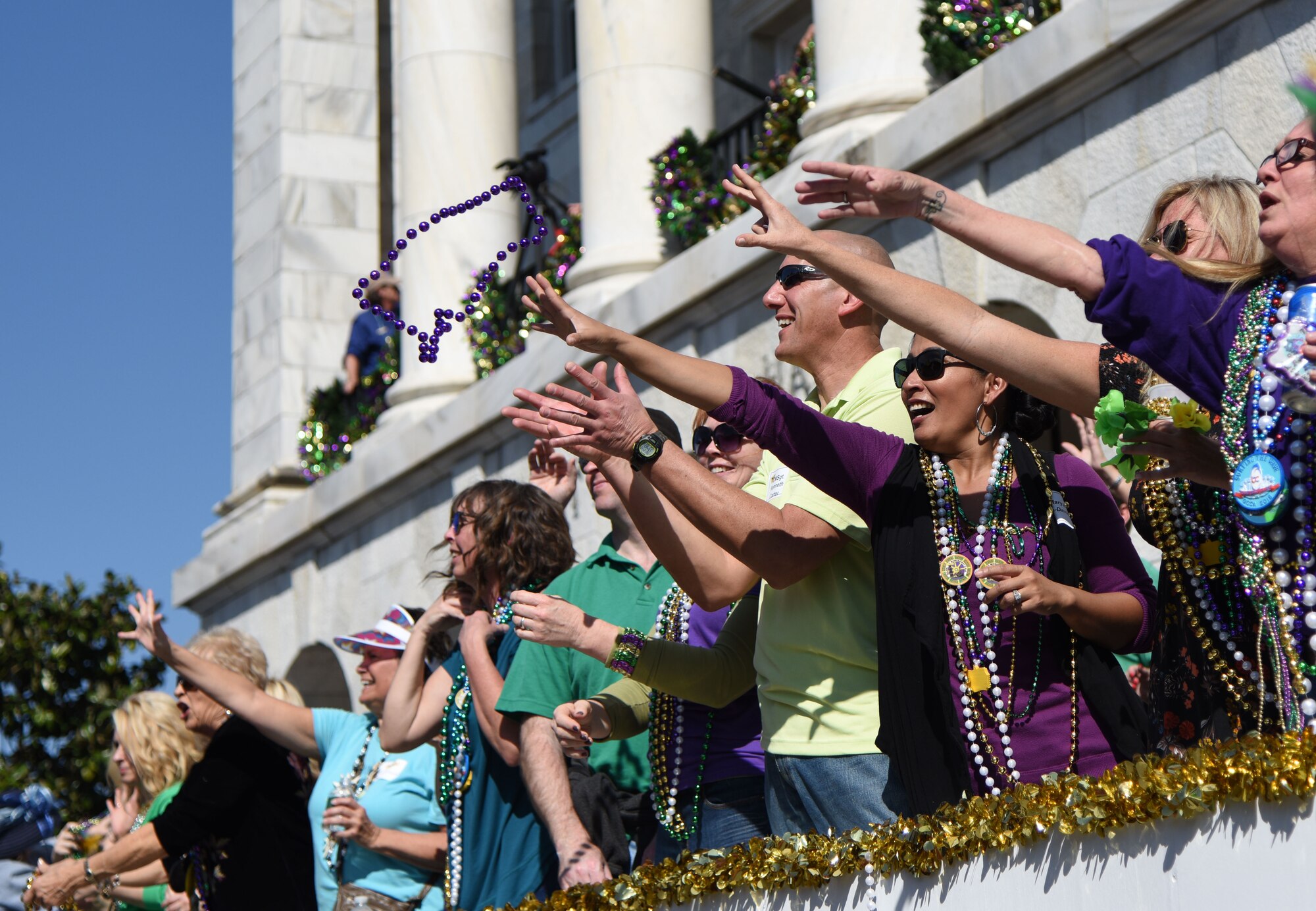 Keesler leadership attends the Gulf Coast Carnival Association Mardi Gras parade Feb. 13, 2018, in Biloxi, Mississippi. Keesler personnel participate in local parades every Mardi Gras season to show their support of the communities surrounding the installation. (U.S. Air Force photo by Kemberly Groue)