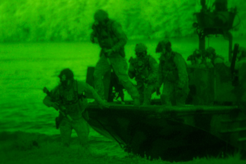 Night-vision photo of Navy SEALs in an exercise.