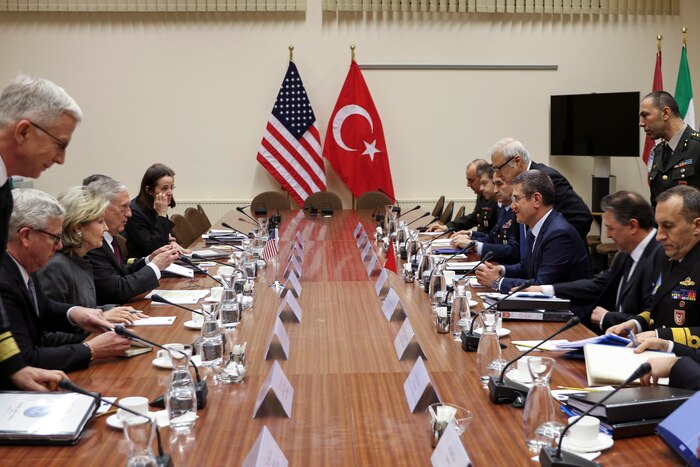 Defense Secretary James N. Mattis sits across a long table from his Turkish counterpart.