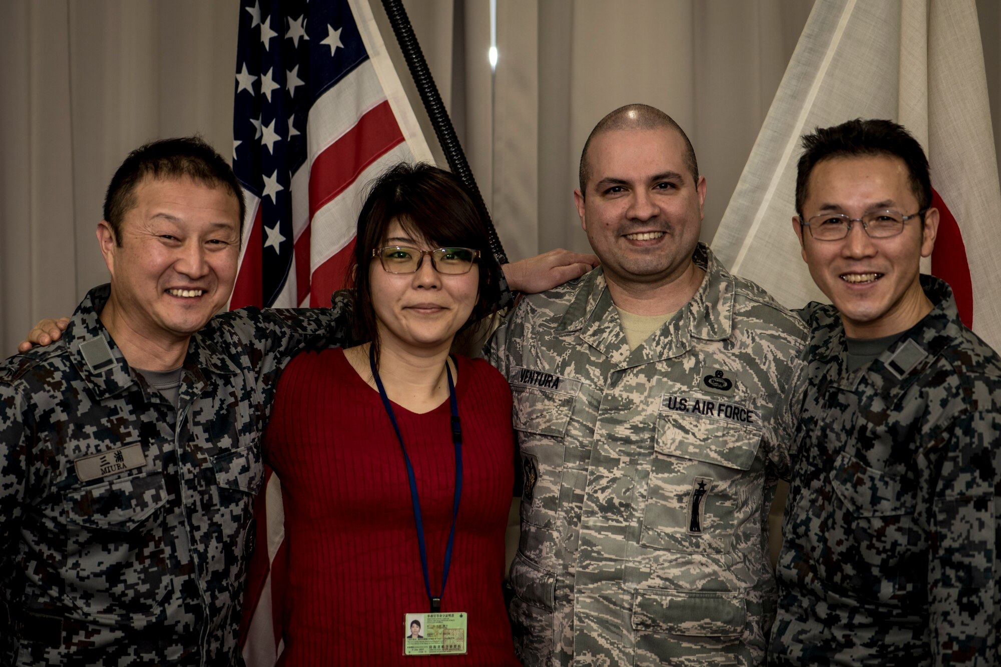 Japan Air Self-Defense Force Warrant Officer Junji Miura, left, the 3rd Air Wing command chief, Noriko Ohtani, center left, a 3rd AW U.S. Relations Section member, U.S. Air Force Master Sgt. Cesar Ventura, center right, a 35th Fighter Wing inspector general vertical inspections planner, and JASDF Warrant Officer Tsuyoshi Endo, right, the former 6th Air Defense Missile Group chief and Senior Noncommissioned Officer Association president, pose for a photo in the 3rd AW headquarters at Misawa Air Base, Japan, Feb. 14, 2018. In the past four years, Ventura worked with Miura, Endo and Ohtani on numerous bilateral events bringing U.S. and Japan servicemembers closer as allies and friends. Ventura attributes his success to his Hispanic upbringing and seeks new adventures every day where he can learn something new about another's culture. (U.S. Air Force photo by Tech. Sgt. Benjamin W. Stratton)