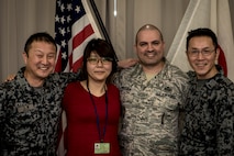 Japan Air Self-Defense Force Warrant Officer Junji Miura, left, the 3rd Air Wing command chief, Noriko Ohtani, center left, a 3rd AW U.S. Relations Section member, U.S. Air Force Master Sgt. Cesar Ventura, center right, a 35th Fighter Wing inspector general vertical inspections planner, and JASDF Warrant Officer Tsuyoshi Endo, right, the former 6th Air Defense Missile Group chief and Senior Noncommissioned Officer Association president, pose for a photo in the 3rd AW headquarters at Misawa Air Base, Japan, Feb. 14, 2018. In the past four years, Ventura worked with Miura, Endo and Ohtani on numerous bilateral events bringing U.S. and Japan servicemembers closer as allies and friends. Ventura attributes his success to his Hispanic upbringing and seeks new adventures every day where he can learn something new about another's culture. (U.S. Air Force photo by Tech. Sgt. Benjamin W. Stratton)