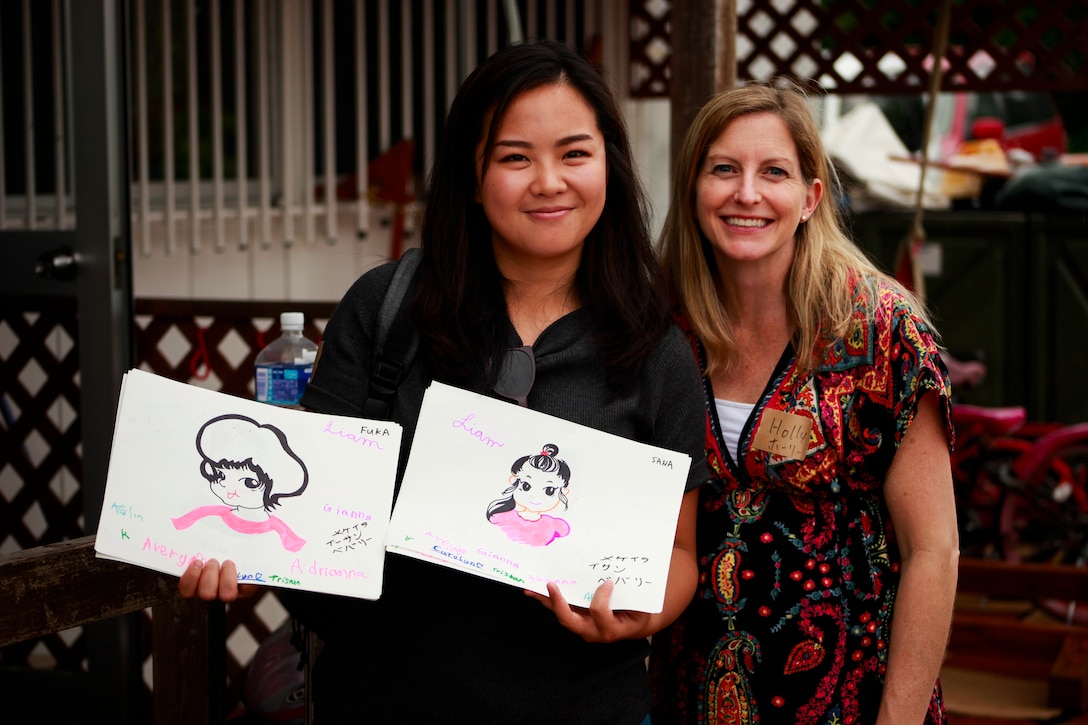 Military spouses of Combat Logistics Battalion 31, 31st Marine Expeditionary Unit, visit local children at the Life is Beautiful Daycare Center in Ishikawa, Okinawa, Japan, Feb. 10, 2018.