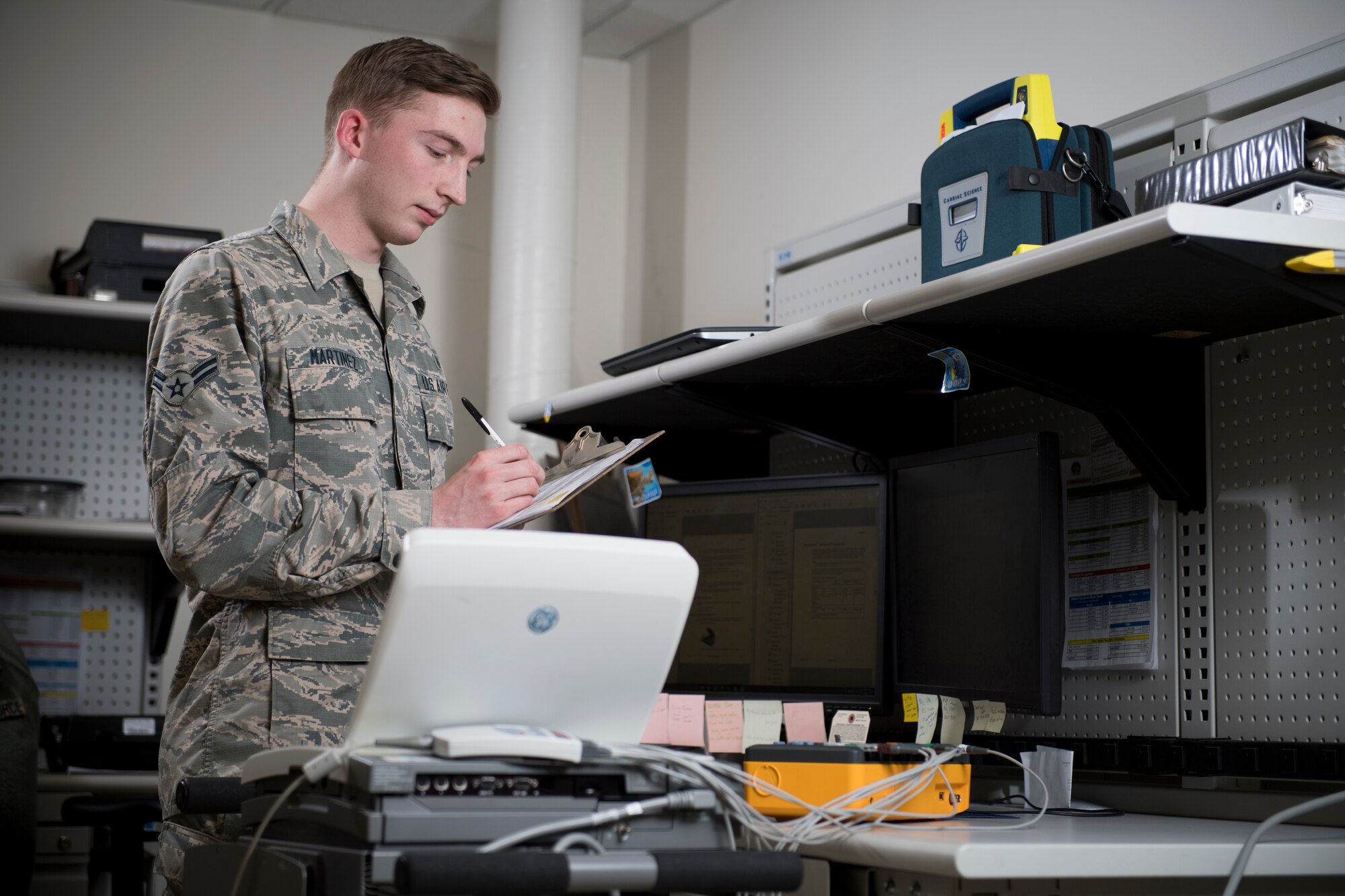 Airman 1st Class Derrek Martinez, 374th Medical Group biomedical repair technician, performs a regular inspection on an electro cardiogram machine, Feb. 14, 2018, at Yokota Air Base, Japan.