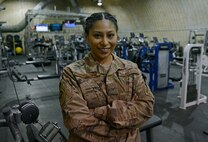 Senior Airman Astrid Hernandez, 455th Expeditionary Force Support Squadron contracting officer representative, poses for a photo in The Rock fitness center Feb. 13, 2018 at Bagram Airfield, Afghanistan.