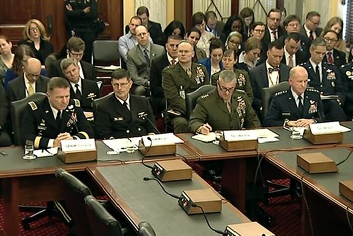 Defense officials sit at a table during congressional testimony