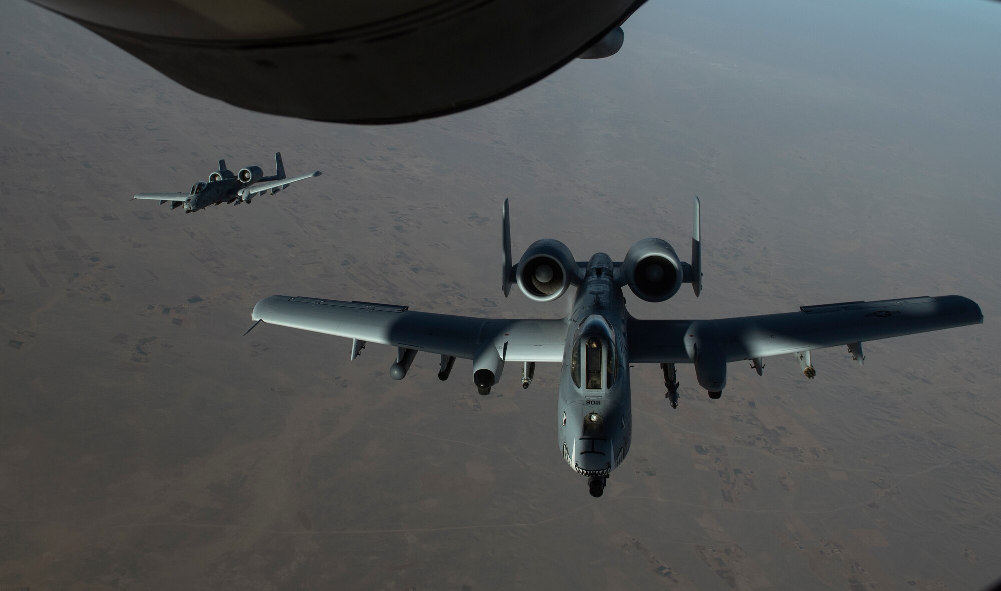 Two U.S. Air Force A-10 Thunderbolt IIs depart after receiving fuel from a KC-135 Stratotanker, assigned to the 340th Expeditionary Air Refueling Squadron Detachment 1, during a refueling mission over Afghanistan, Feb. 7, 2018.