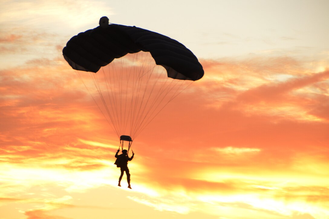 A pararescueman of the New York Air National Guard 106th Rescue Wing, pilots his canopy while descending, after jumping out of an HC-130P/N King aircraft over Francis S. Gabreski Air National Guard Base, N.Y., Dec. 19, 2017. This Airman is participating in a military free-fall operation being conducted for currency, proficiency and upgrade training purposes. (U.S. Air National Guard photo by Airman Sean Madden)