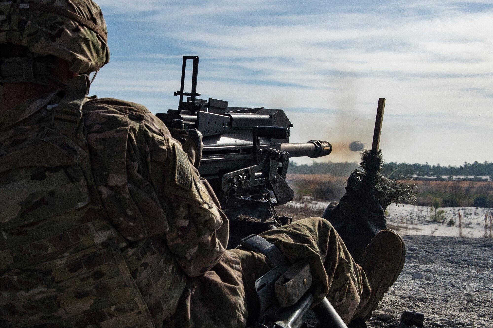 An Airman from the 824th Base Defense Squadron, fires a Mark 19 40mm grenade machine gun, Jan. 26, 2018, at Camp Blanding Joint Training Center, Fla. The Airmen traveled to Blanding to participate in Weapons Week where they qualified on heavy weapons ranging from the M249 light machine gun to the M18 Claymore mine. (U.S. Air Force photo by Senior Airman Janiqua P. Robinson)