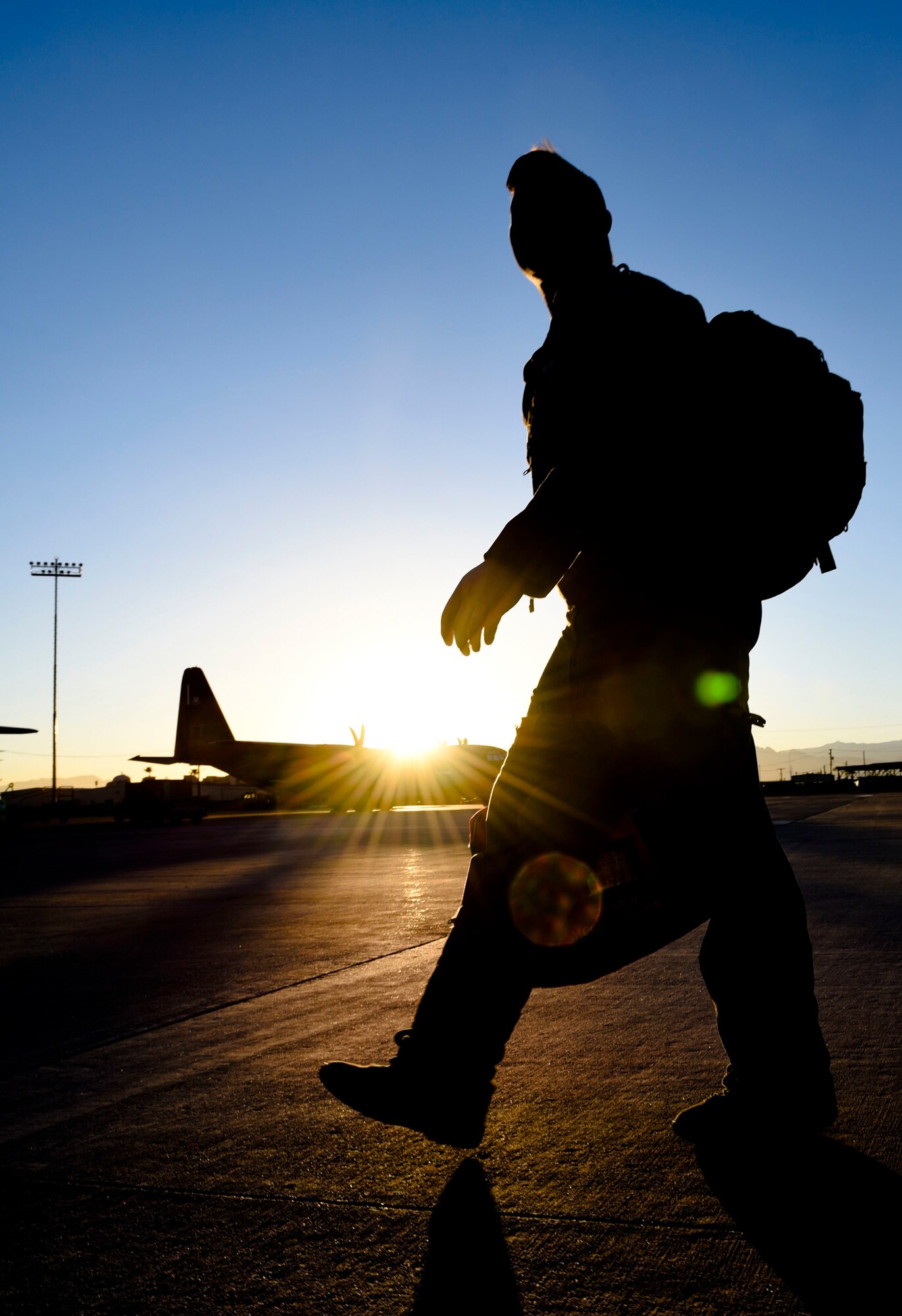 Senior Airman Dan Daley, a boom operator assigned to Fairchild Air Force Base, Wash., walks on the flightline during Red Flag 18-1, Feb. 7, 2018, at Nellis AFB, Nev. Red Flag gives Airmen an opportunity to experience realistic combat scenarios that prepares them for real-world conflicts. (U.S. Air Forcae photo by Airman 1st Class Andrew D. Sarver)