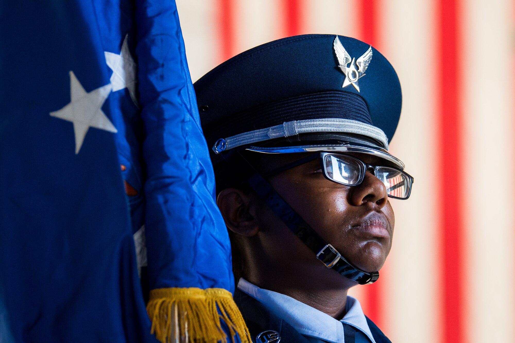 Airman 1st Class Myshanique Jones, Travis Air Force Base Honor Guard, holds the Air Force flag during the 75th anniversary kickoff celebration at Travis AFB, Calif., Feb. 8, 2018. Travis AFB is celebrating 75 years as a major strategic logistics hub for the Pacific and integral part of global power projection for the total force. (U.S. Air Force photo by Master Sgt. Joey Swafford)
