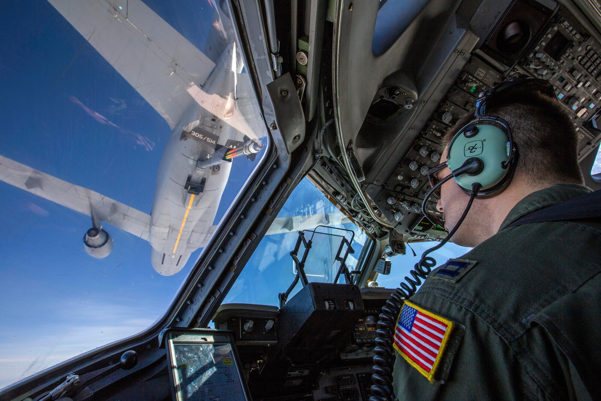 Capt. Thomas Beltz, C-17 Globemaster III pilot with the 514th Air Mobility Wing, closes in to refuel with a KC-10 Extender over the Atlantic Ocean, Feb. 10, 2018. The 514th AMW is an Air Force Reserve Command unit located at Joint Base McGuire-Dix-Lakehurst. (U.S. Air Force photo by Master Sgt. Mark C. Olsen)