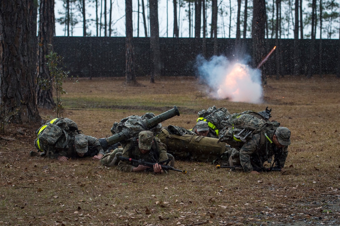 Airmen duck for cover as a non-lethal grenade explodes during a Pre-Ranger Assessment, Feb. 11, 2018, at Moody Air Force Base, Ga. The three-day course is designed to determine whether Airmen are ready to attend the Air Force Ranger Assessment Course held at Fort Bliss Army Post, Texas. (U.S. Air Force photo by Senior Airman Janiqua P. Robinson)