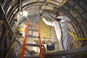 (02/13/2018) -- National Museum of the U.S. Air Force restoration specialist Brian Lindamood paints the bomb bay of the Boeing B-17F Memphis Belle. Plans call for the aircraft to be placed on permanent public display in the WWII Gallery here at the National Museum of the U.S. Air Force on May 17, 2018. (U.S. Air Force photo by Ken LaRock)