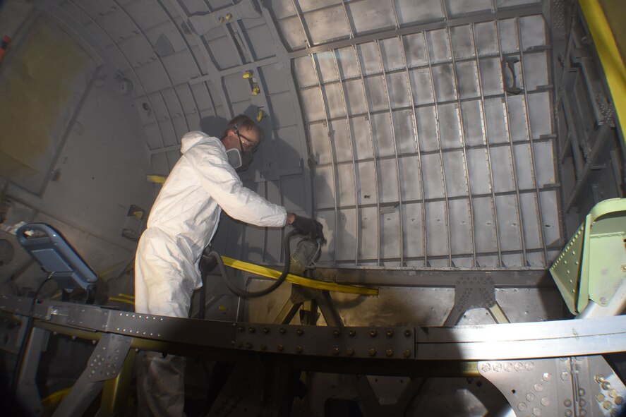 (02/13/2018) -- National Museum of the U.S. Air Force restoration specialist Brian Lindamood paints the bomb bay of the Boeing B-17F Memphis Belle. Plans call for the aircraft to be placed on permanent public display in the WWII Gallery here at the National Museum of the U.S. Air Force on May 17, 2018. (U.S. Air Force photo by Ken LaRock)