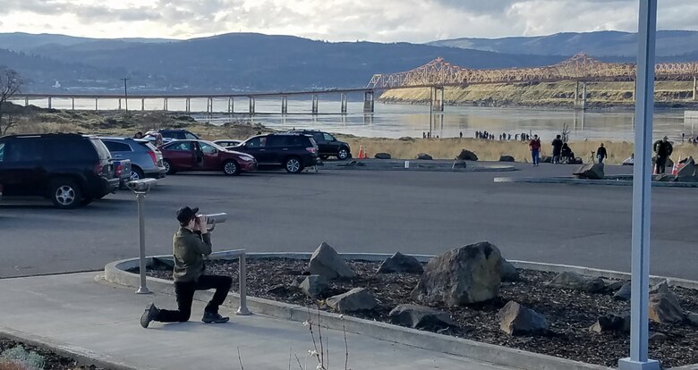 A visitor views eagles through a newly-installed spotting scope at The Dalles Dam Visitor Center, Jan. 2018.