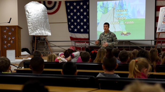Maj. Chris Jordan, 628th Medical Group Deily Dental Clinic chief of dental services, speaks to students about the importance of dental hygiene during a visit at the Marrington Elementary School Feb. 14, 2018 in South Carolina.