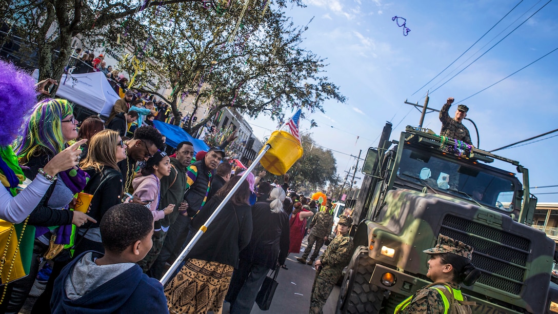 Marines participate in a parade during Mardi Gras festivities in New Orleans.