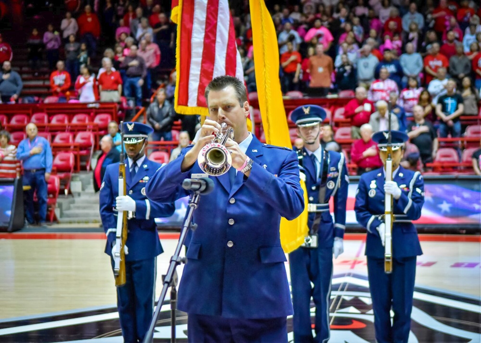 Kirtland Air Force Base Chaplain Capt. Thomas “Andy” Peck performs the National Anthem prior to the Air Force vs. University of New Mexico women’s basketball game on Saturday, Feb. 10 at Dreamstyle Arena.